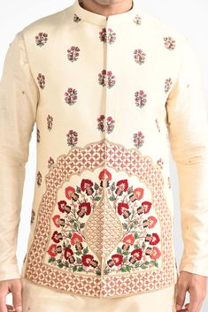 Rajasthani floral Hand embroidered nehru kurta set made in cream bamberg raw silk. Paired with cream slim fit Pant Pajama. Color of the actual garment may vary due to lighting conditions during the shoot.

Size Chart For Men





	
	
					Men's Size Chart
		

		
		
						
				Size Chart For Men
				Custom Size Measurement Guide
			
			
				
				
				Custom Size Measurement Guide
1. Take your measurements at ease…don’t hold your breath!
2. Be a little generous with the measurements. It’s always e Raw Silk Bandhgala With Intricate Embroidery For Traditional Ceremonies, Cream Sets With Floral Embroidery For Transitional Season, Transitional Floral Embroidered Cream Sets, Transitional Cream Sets With Floral Embroidery, Transitional Off-white Sets With Floral Embroidery, Cream Embroidered Sets With Traditional Drape, Cream Raw Silk Kurta With Traditional Drape, Cream Bandhgala With Chikankari Embroidery In Raw Silk, Traditional Beige Raw Silk Sherwani