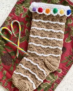 a crocheted christmas stocking with candy canes