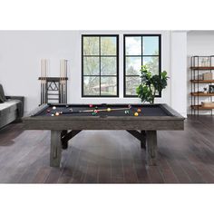 a pool table in the middle of a living room