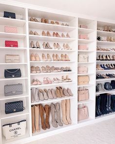 a white closet filled with lots of shoes and handbags on shelves next to each other