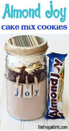 a jar filled with cookies next to a bag of chocolate chips and a candy bar