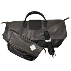 Brouk & Co Alpha Vegan Leather Duffel Bag Travel Set 2 Piece Set. Duffle Bag And Toiletry Bag. Attachable Strap. Zip And Snap Closure With Inside Zipped Pocket. Color: Black And Gray New With Tags. Excellent Condition. Measurements Laid Flat: Weekender/Duffle: 26 X 12" Travel: 13 1/2 X 7 1/2” Offers Welcomed. Bundle And Save! Tags: Business, Professional, Travel Black Travel Bag With Detachable Handle For On-the-go, Modern Black Travel Bag With Detachable Handle, Black Leather Travel Bag With Detachable Handle, Black Travel Bag With Detachable Handle For Everyday Use, Black Bag With Gunmetal Hardware For Travel, Gray Bag With Detachable Handle For Travel, Gray Satchel With Detachable Strap For Travel, Black Travel Bags With Magnetic Closure, Gray Shoulder Bag With Gunmetal Hardware For Travel