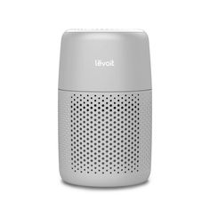 a white and gray speaker on a white background