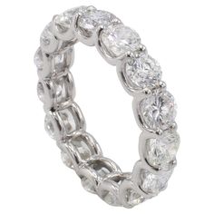 a white gold ring with round cut diamonds on the inside and outside, set in 18k white gold