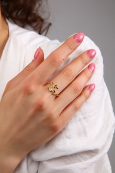 "Olive Leaf Cute Ring, is perfect for your loved one. A perfect gift for mom, daughter, wife, girlfriend, classmates and friends. A clear choice for Graduation Gift, Mother's Day gift, Valentine's Day gift, a uniquely beautiful ring that you can treasure forever. While the ring is 925 sterling silver, the Gold and Rose Gold ones are 18 carat gold plated on silver. Coatings may also change color if they are exposed to water for a long time, come into contact with perfume, body oils and other chemicals. * Handmade with love ♡ * Material: 925 Sterling Silver * Finish: 18K Gold, 18k Rose Gold, 925 Sterling Silver * Package: All Jewelry will be carefully packaged and sent in a beautiful gift box! Combine it with any other piece or wear it on its own, this unique piece will always stand out. Mad Tiffany And Co Olive Leaf Ring, White Gold Hypoallergenic Midi Rings For Wedding, Dainty Hypoallergenic Midi Rings For Wedding, Delicate Midi Rings With Simple Design For Gift, Delicate Midi Rings With Simple Design As Gift, Dainty Hypoallergenic Rings For Anniversary, Hypoallergenic Dainty Rings For Anniversary, Adjustable Hypoallergenic Midi Rings For Wedding, Dainty Hypoallergenic Stackable Rings For Wedding