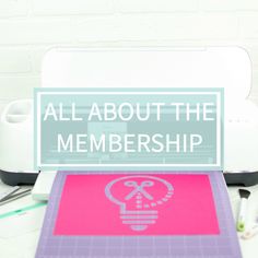 a sign that says about the membership sitting on a desk next to a printer