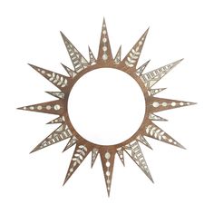 a circular mirror with decorative designs on it