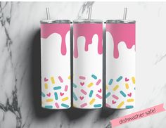 three pink and white tumblers with sprinkles on them