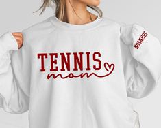 Customize this tennis mom shirt to meet your needs! Choose from short sleeve, long sleeve, hoodies, and crewneck sweatshirts and add your favorite players name! Other color options and styles are available. If you don't see what you're looking for send us a message! The shirts are a UNISEX retail fit - they are more of a relaxed fit and may run a little large on women and those with a smaller frame . Make sure to see the size charts (last images) to confirm the best fit for you. We recommend mea Tennis Mom Shirts, Cotton Tennis Sweatshirt With Relaxed Fit, Cotton Tennis Sweatshirt In Relaxed Fit, Cotton Sweatshirt With Name Print For Sports Season, Long Sleeve Graphic Sweatshirt For Tennis, Long Sleeve Graphic Print Sweatshirt For Tennis, Graphic Print Long Sleeve Sweatshirt For Tennis, Graphic Print Long Sleeve Tennis Sweatshirt, Cotton Crew Neck Sweatshirt For Tennis