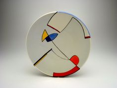 a white plate with an abstract design on it