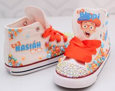 How adorable are these Blippi inspired converse! The perfect shoe to complete the look! Visit the tutu section or search bar for the matching outfit! If you are unsure of sizing please scroll to the last photos for our size charts, or visit our size charts here--> https://pinktoesnhairbows.com/pages/size-chart All sales are FINAL, Ship dates can be found directly on the listing, please view our policies in detail here---> https://pinktoesnhairbows.com/pages/policies-terms-conditions Overalls Boys, Tutu Dress Costumes, Bling Converse, Glitter Tee, Girls Overalls, Girls Converse, Matching Outfit, Custom Glitter, Birthday Tutu