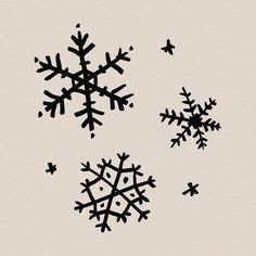 three snowflakes are shown in black on a white background with birds flying around