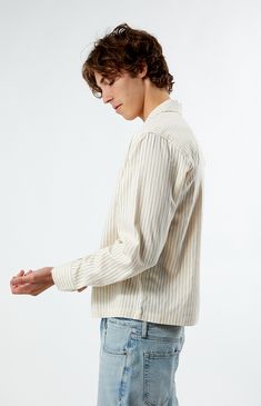 Stay stylish with the PacSun Long Sleeve Stripe Camp Shirt, featuring a classic collared neckline and button closures for a polished look. With its striped pattern and left chest logo, this shirt offers a versatile addition to your wardrobe in a comfortable regular fit, perfect for any occasion.


	Collared neckline
	Long sleeves
	Regular fit
	Button closures
	Left chest embroidered logo
	Striped
	80% Cotton, 20% polyester
	Machine washable
	Model is wearing size medium
	Model Measurements: 6’1”  Height, 30” Waist, 35” Hips Classic Camp Shirt With Lapel Collar For Spring, Casual Tops With Striped Spread Collar, Spring Top With Striped Spread Collar, Classic Striped Shirt With Camp Collar, Striped Collared Shirt With Placket, Classic Collared Pinstripe Tops, Summer Tops With Striped Camp Collar, Classic Pinstripe Collared Top, Summer Camp Collar Tops With Striped Collar