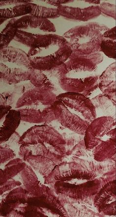 an artistic drawing of red feathers on white paper