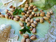 nuts and leaves on a table cloth with lace