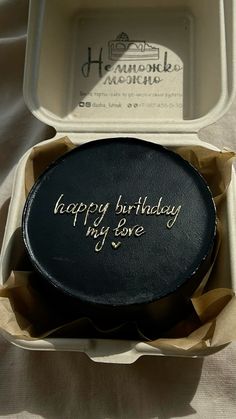 a birthday cake in a white box with writing on it that says happy birthday my love