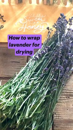 fresh lavender flowers are sitting on a wooden table