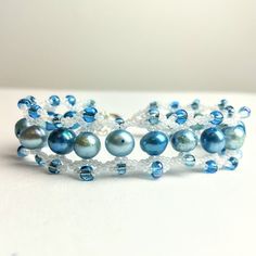 Handmade, Handwoven Bracelet, Made By Me Brand New! Woven Pearly White Glass Seed Beads With Light Blue Beads And Dyed Freshwater Pearl Accents. Measures 8 Inches, Plus An Extension Chain. Don't Like The Price? I'm Open To Offers! Adjustable Blue Pearl Bracelet Gift, Adjustable Blue Pearl Bracelet For Gift, Handmade Adjustable Blue Pearl Bracelet, Blue Beaded Pearl Bracelet With Round Beads, Blue Beaded Pearl Bracelet, Hippie Jewelry Bracelets, Witch Bracelet, David Yurman Cable Bracelet, Kate Spade Bracelet