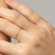 our Tiny Dancer Ring is as much of a classic as the beloved song it is named after. an ideal choice for minimalists or active lifestyles, you can't go wrong with this effortless band. ideal for stacking and a staple in curating your capsule jewelry collection. fine 14k solid gold .49 grams .9mm thick Double Band Stackable Everyday Bands, Adjustable Simple Stackable Rings For Promise, Everyday Double Band Stackable Bands, Simple Open Band Stackable Jewelry, Simple Stackable Open Band Jewelry, Modern Stackable Midi Rings For Promise, Dainty Adjustable Stackable Rings For Everyday, Minimalist Open Band Diamond Ring For Everyday, Everyday Dainty Stackable Rings