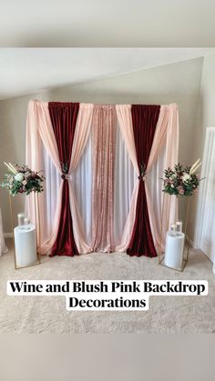 wine and blush pink back drop decorations in front of a white backdrop with red drapes