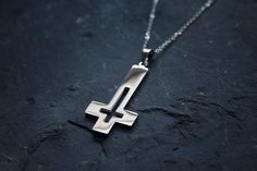 Upside down cross with a hollowed out design. Made in very shiny stainless steel. Comes with chain! Ships worldwide from Sweden! © 2020 Torvenius Illustration ABModel is Christina Zelmerlöw feathersandflesh_@instagram Modern Handmade Stainless Steel Necklaces, Modern Handmade Stainless Steel Necklace, Modern Stainless Steel Cross Necklace For Gift, Handmade Stainless Steel Cross Jewelry, Modern Stainless Steel Cross Jewelry, Handmade Stainless Steel Cross Pendant Necklace, Handmade Stainless Steel Cross Pendant Jewelry, Handmade Stainless Steel Cross Necklace, Handmade Stainless Steel Cross Pendant