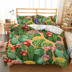 a bed room with a neatly made bed and a cactus print comforter set on it