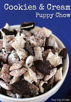 a white bowl filled with cookies and oreo cookie mix on top of a blue table