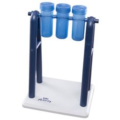 three blue water bottles are placed on top of a white stand with four black plastic tubes