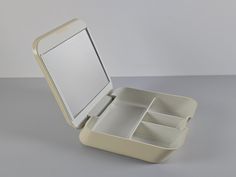 Fabulous space-age beige plastic 'Beauty Box' with mirror, cosmetics and jewellery container box from the 1970s by Makio Hasuike for Gedy Italy. * Please Get In Touch With Me For Any Questions Or To Combine Shipping Fees * - Dimensions: Width 25, Depth 29, Height 7 cm. - Condition: Excellent overall with normal wear consistent with age--the box is discolored but in excellent condition.. - Made in Italy. Visit my shop for more unique items: https://www.etsy.com/nl/shop/NeospaceObjects VINTAGE CON Makio Hasuike, Space Age Design, Mirror Case, Desk Inspo, Toiletry Storage, Space Age, Beauty Box, Makeup Mirror, Makeup Organization