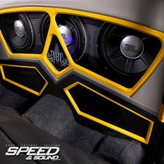 the interior of a sports car with two speakers