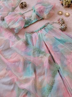 Designer Lehenga for wedding, Reception, Haldi & Mehendi available on Label Kanupriya Shop now on www.labelkanupriya.com E-mail us your queries on labelkanupriya@gmail.com #lehenga #lehengawedding #haldioutfit #mehendioutfit #reception #indianwedding #designerlehenga Pastel Organza Lehenga, Lehenga With Pallu In Organza, Organza Lehenga With Dupatta For Festivals, Pink Organza Lehenga With Pallu, Organza Lehenga With Dori Work, Organza Tops