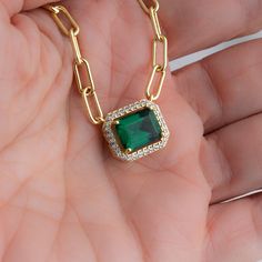 "Make a statement with this stunning necklace! Featuring an emerald pendant and paperclip chain. It will instantly transform your outfit!  - - - D E T A I L S - - - * 14k Gold or Rhodium plated brass - we use a THICK plating of 14k Gold and Rhodium for a piece that will be with you for years to come! * Emerald Stone: 8x10mm * 16\" + 3\" Ext * Nickel-free & Hypoallergenic * Lobster clasp Closure Necklaces on Model: https://www.etsy.com/listing/906768350/solitaire-necklace-dainty-bezel-necklace?click_key=8861cf7a6ca15ae17b47f35da89871a3fa28ed1a%3A906768350&click_sum=aafcdf8d&ref=shop_home_active_8&pro=1&sts=1 https://www.etsy.com/listing/1238983032/dainty-necklace-minimalist-necklace?click_key=98ded69e7dba1ff49feaa83b5a262a090c5a0a6f%3A1238983032&click_sum=57cb82ff&ref=shop_home_active_34&pr Elegant Green Necklace With Paperclip Chain, Gold Emerald Necklace, Emerald Chain, Schmuck Gold, Baby Gadgets, Bezel Necklace, Solitaire Necklace, Solitaire Necklaces, Emerald Pendant