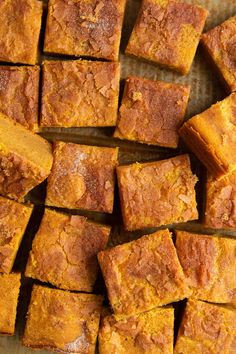 several pieces of pumpkin bread sitting on top of a pan