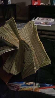 a stack of money sitting on top of a table