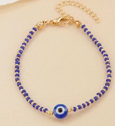 Blue evil eye decor bracelet. Perfect for gifts for her. Trendy Blue Bracelets With Tiny Beads, Evil Eye Bead Bracelet Gift, Trendy Blue Jewelry With Tiny Beads, Blue Spiritual Bracelets With Letter Beads, Spiritual Blue Bracelets With Letter Beads, Blue Beaded Bracelets With Evil Eye, Bohemian Evil Eye Bracelet With 8mm Beads, Bohemian Evil Eye Beaded Bracelets For Jewelry Making, Bohemian Beaded Bracelets For Jewelry Making With Evil Eye