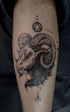 a ram tattoo on the leg of a man