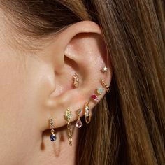 a close up of a person with ear piercings on their left and right ears