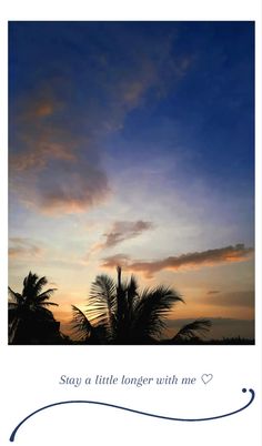 the sun is setting behind some palm trees and there are clouds in the sky above it