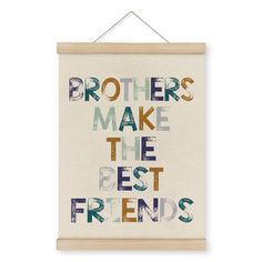 a sign that says brothers make the best friends hanging on a white wall with a wooden frame