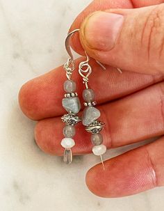 This pair of silver plated earrings features silver plated ear wires, hoops and paddle pins, along with an aquamarine chip, lavender agate beads, czech glass and silver spacer beads. Each pair of earrings comes with silicone stoppers to hold the earring in place securely. These measure 1.75 inches in total length. o ~ TURNAROUND TIME ~ Ready to ship items, such as earrings, will ship in 1-2 business days.  o ~ CUSTOMER CARE ~ Please contact us if you have any questions or need help placing an or Gray Ear Wire Earrings For Gift, Sterling Silver Gray Dangle Jewelry, Gray Sterling Silver Dangle Jewelry, Gray Sterling Silver Dangle Earrings, Gray Dangle Earrings With Ear Wire, Purple Jewelry, Dangly Earrings, Hand Crafted Gifts, Jewelry For Her