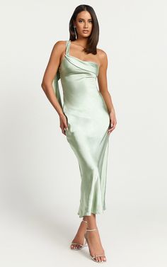 Elevate your wardrobe with the Calix Midi Dress - a stunning One Shoulder Slip Dress that enchants in a sophisticated Sage green. Crafted from luxurious satin and designed for the woman who loves to express her individuality, this dress is more than just a piece of clothing it's a statement. Product Details: Slip Dress Satin Fabric One Shoulder Formal, Party Midi Length Polyester Material Material and Care 100% Polyester Low / No stretch Slip Dress Satin, Basic Black Dress, Bachelorette Dress, Maxi Dresses Fall, Long Sleeve Dress Formal, Spring Capsule Wardrobe, White Long Sleeve Dress, Long White Dress, Puff Sleeve Dresses