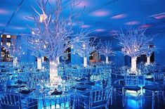 a room filled with lots of tables and chairs covered in snowflakes on top of them