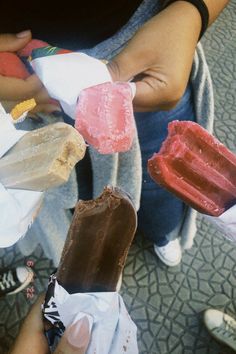 several people holding different types of ice cream