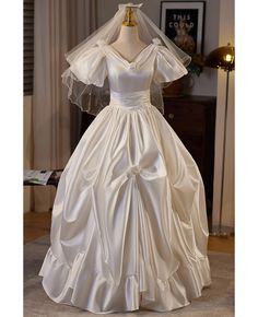 Buy ruffled ballgown satin vneck wedding dress with bubble sleeves at wholesale price online. Free shipping and pro custom service since 2009. Satin Ball Gown With Ruffles For Wedding, Wedding Satin Ball Gown With Ruffles, Satin V-neck Ball Gown For Wedding, V-neck Satin Ball Gown For Wedding, Vneck Wedding Dress, Delicate Gown, V Neck Wedding Dress, Standard Dress, Wedding Fabric