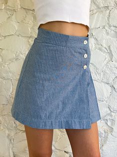 This is a wrap mini-skirt, double-pleated on one side. It's flirty and short and has a matching vest. This one is soft blue cotton with a small white pinstripe. All our fabrics are upcycled deadstock. Dry-clean. NOTE: The skirts in this batch are running a bit small in the hips. Consider sizing up. Wrap Mini Skirt, Fire Fits, Diy Couture, Spring Wardrobe, Girly Fashion, Spring Summer Outfits, Upcycle Clothes, Babydoll Dress, Diy Clothes