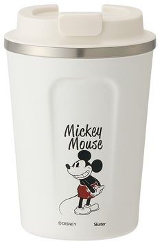 the mickey mouse cup is white and has a silver lid