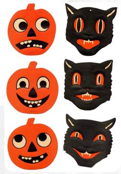 four pumpkins with faces painted on them and one has a cat's face