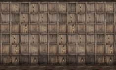 an old wooden paneled wall with many squares and lines on it's sides