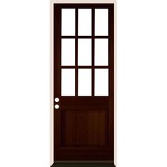 the front door is brown and has two glass panels on each side, one with a small