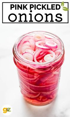 pink pickled onions in a jar with text overlay that reads, pink pickled onions